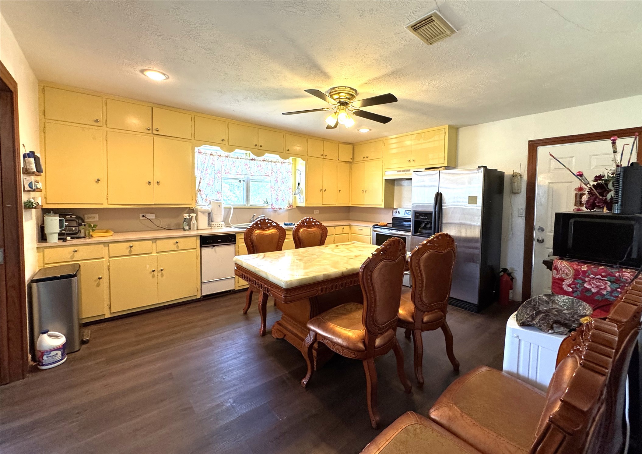 1435 Shaws Bend Road Columbus, TX 78934 - Photo 10 of 36 a view of a dining room with furniture window and wooden floor
