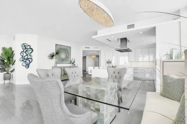 a living room with furniture ceiling fan and a window