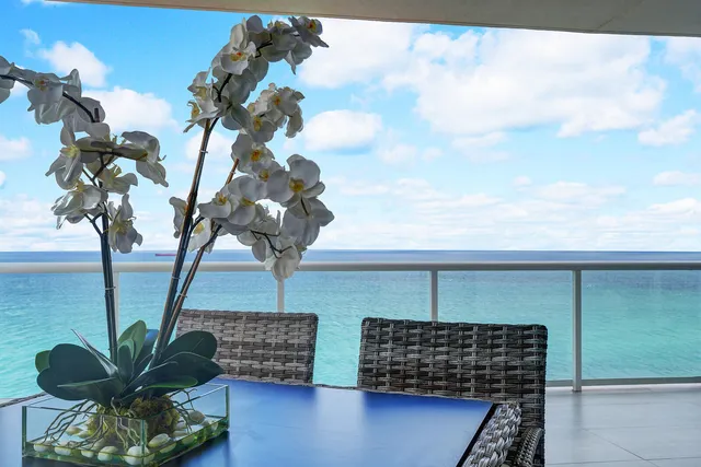 a vase of flowers sitting on a table