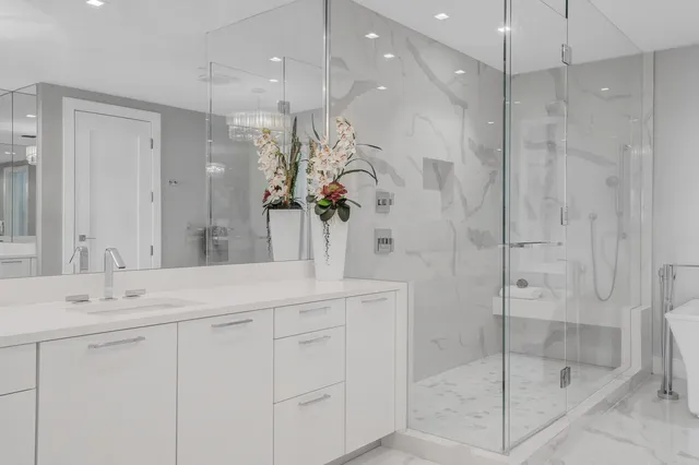 a bathroom with a toilet a sink and a shower