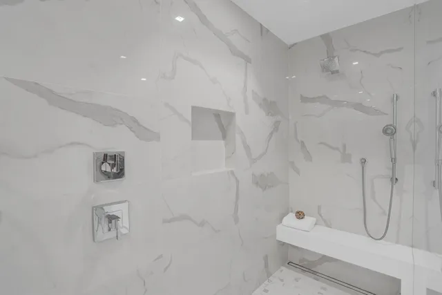 a view of walk in closet with clothes