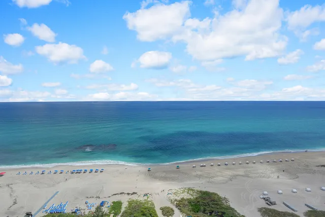a living room with furniture fireplace and a flat screen tv