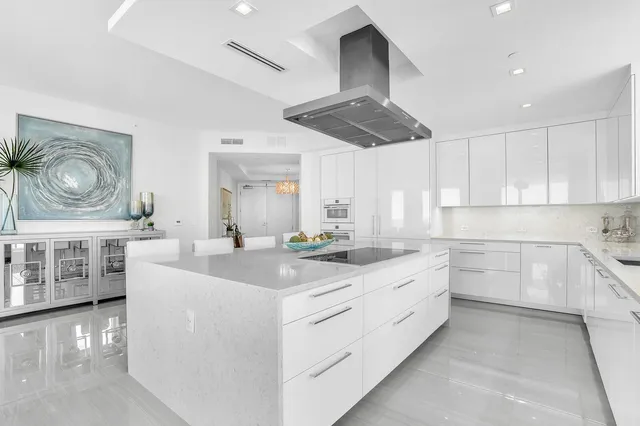 a view of a dining room with furniture large windows and wooden floor