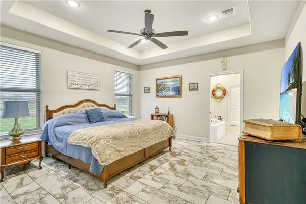 a bedroom with a bed and a dresser