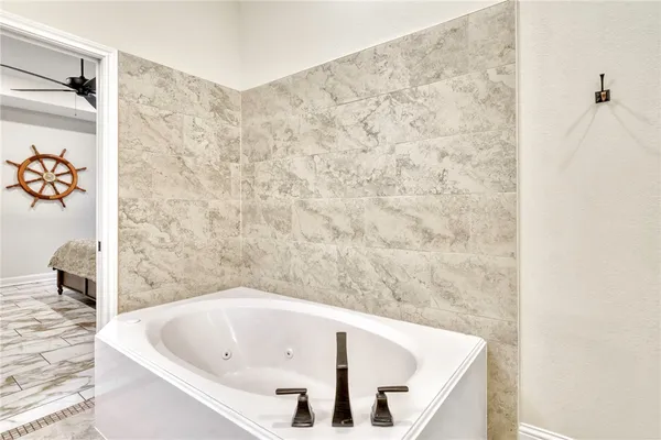 a bathroom with a white bath tub