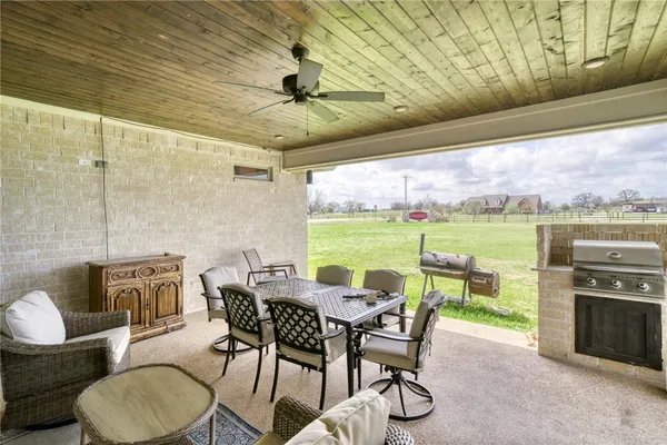 a patio with patio outdoor seating and yard