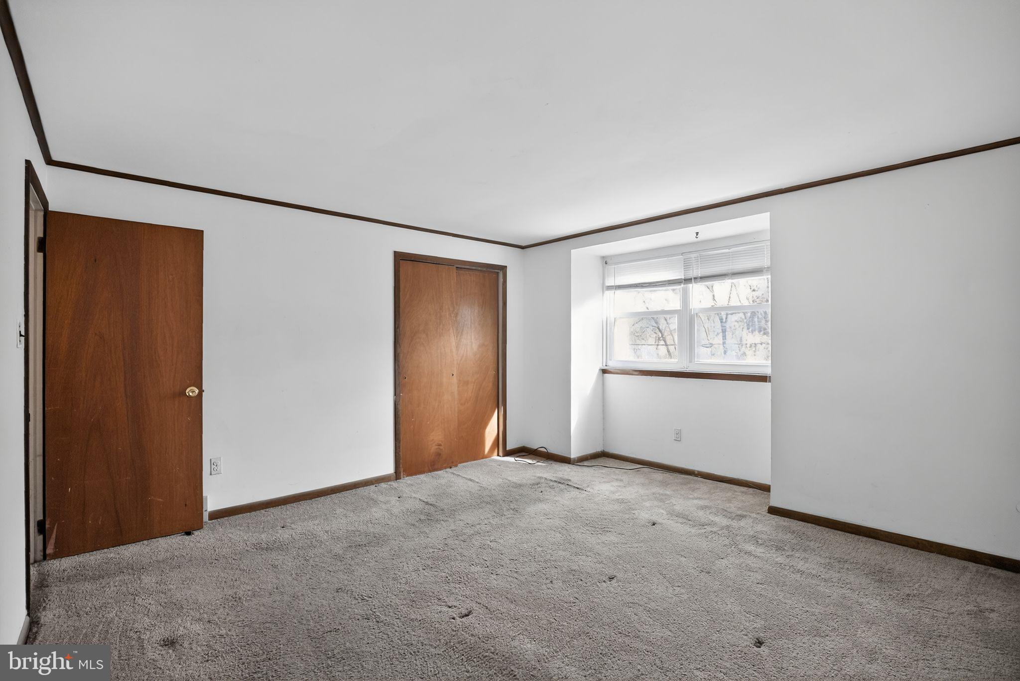 1403 Rainer Road Brookhaven, PA 19015 - Photo 13 of 25 an empty room with windows and closet