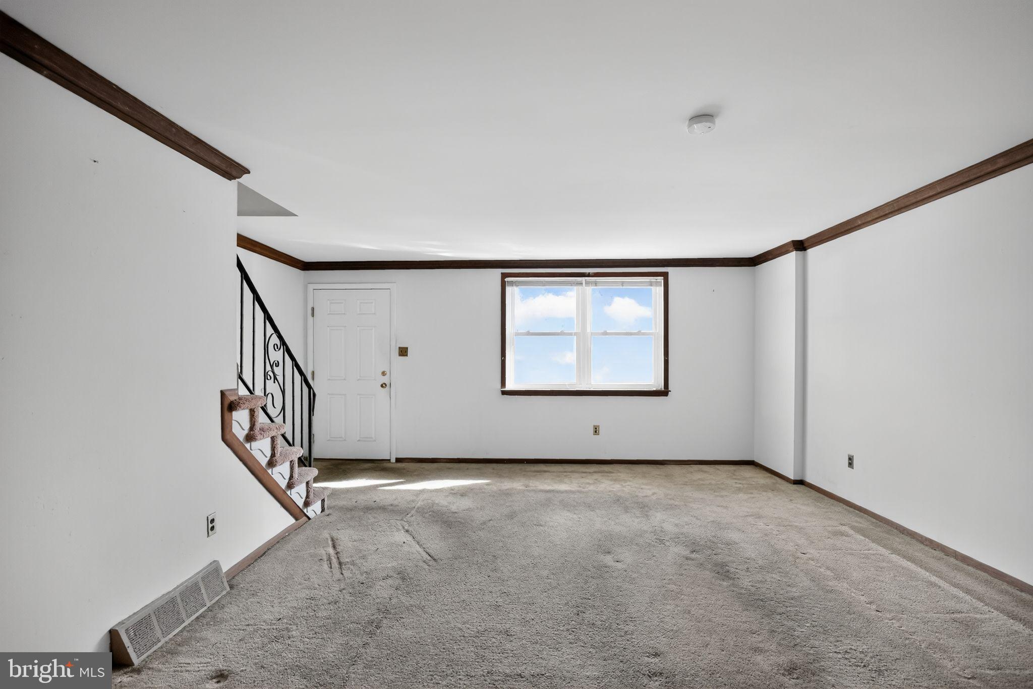 1403 Rainer Road Brookhaven, PA 19015 - Photo 2 of 25 a view of an empty room with a window