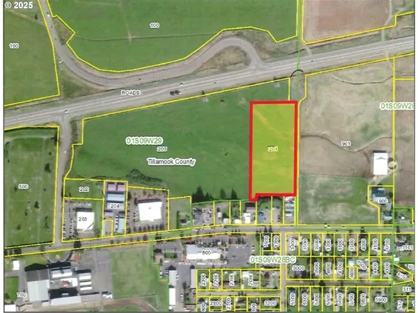 a front view of a building with outdoor space and seating area