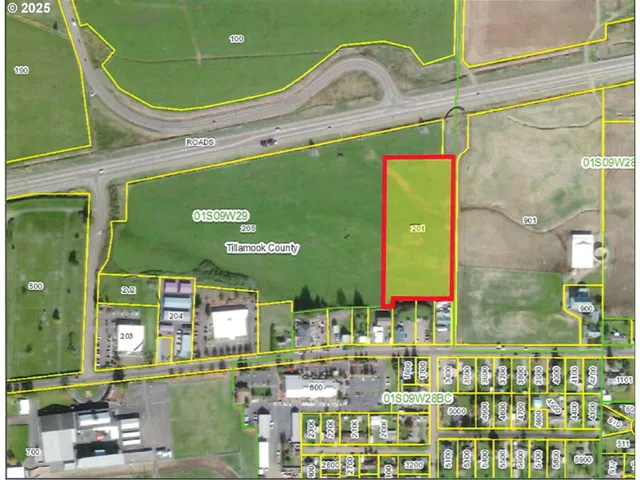 a front view of a building with outdoor space and seating area