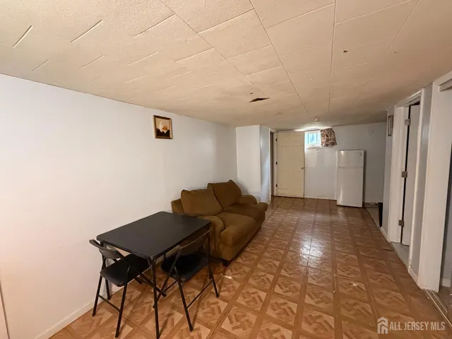 a utility room with cabinets washer and dryer