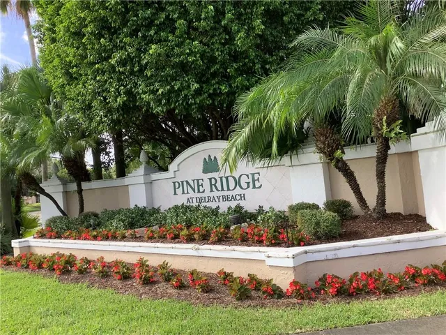 a view of garden with flowers and trees