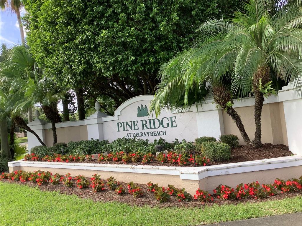 7904 Mansfield Hollow Road Delray Beach, FL 33446 - Photo 1 of 27 a view of garden with flowers and trees