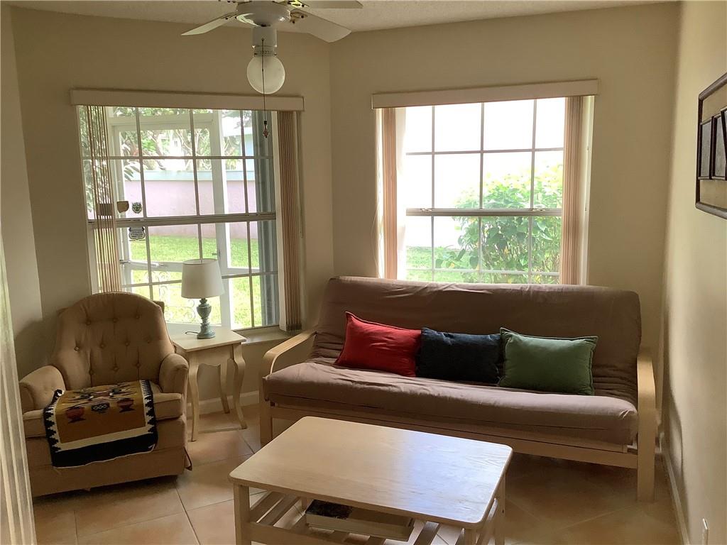 7904 Mansfield Hollow Road Delray Beach, FL 33446 - Photo 11 of 27 a living room with furniture and a window