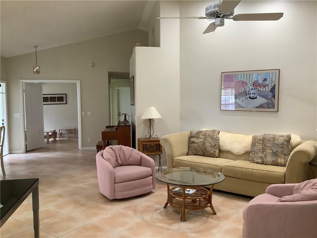 7904 Mansfield Hollow Road Delray Beach, FL 33446 - Photo 9 of 27 a living room with furniture and a couch
