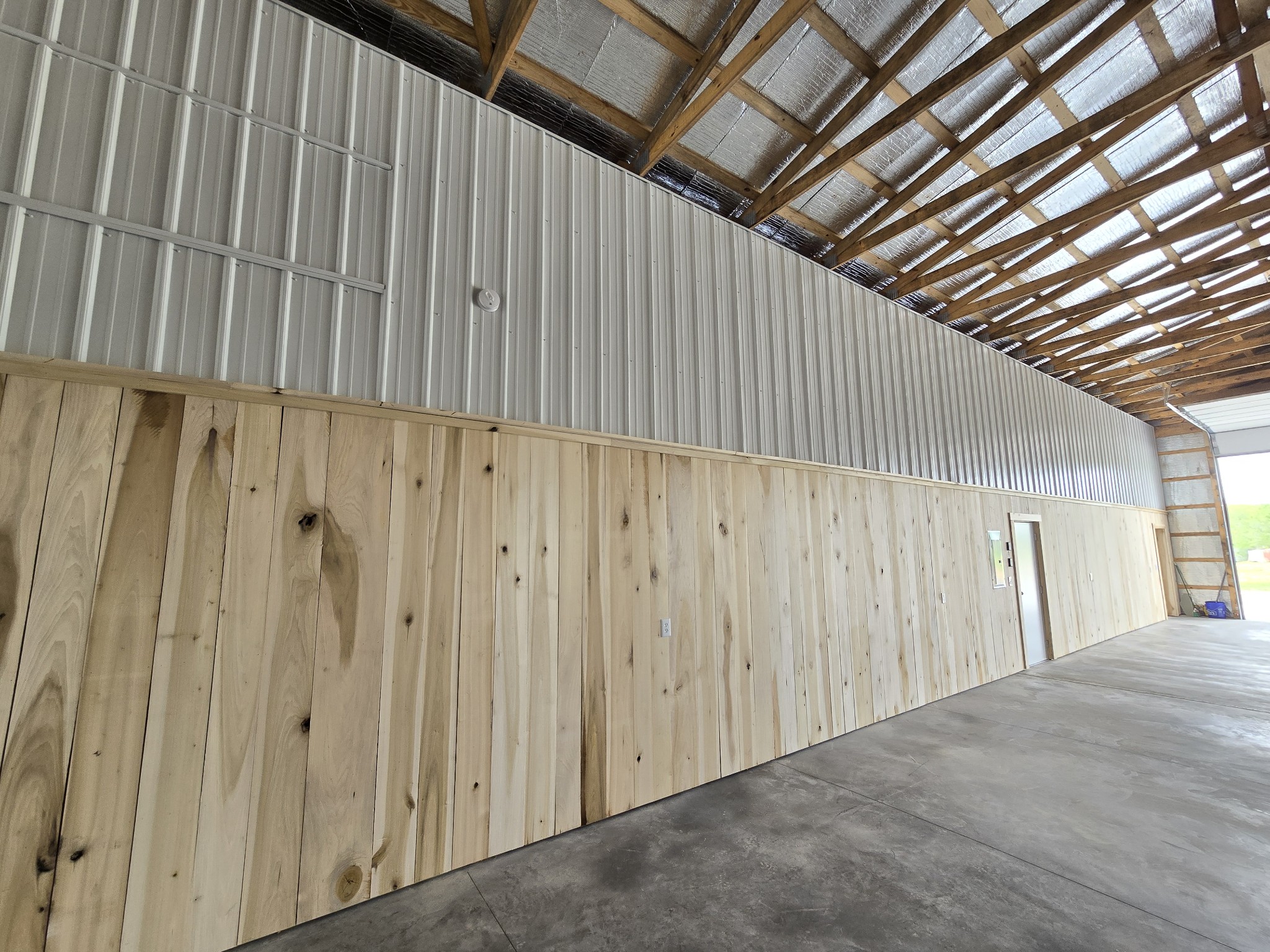 1116 Maxwell Branch Road Cottontown, TN 37048 - Photo 15 of 57 One wall in the main section of Barn is lined with Poplar and Metal. The other side of this wall is the enclosed shed with approx 776 sf and has been finished out to include a bathroom, office area, storage, and much more.
