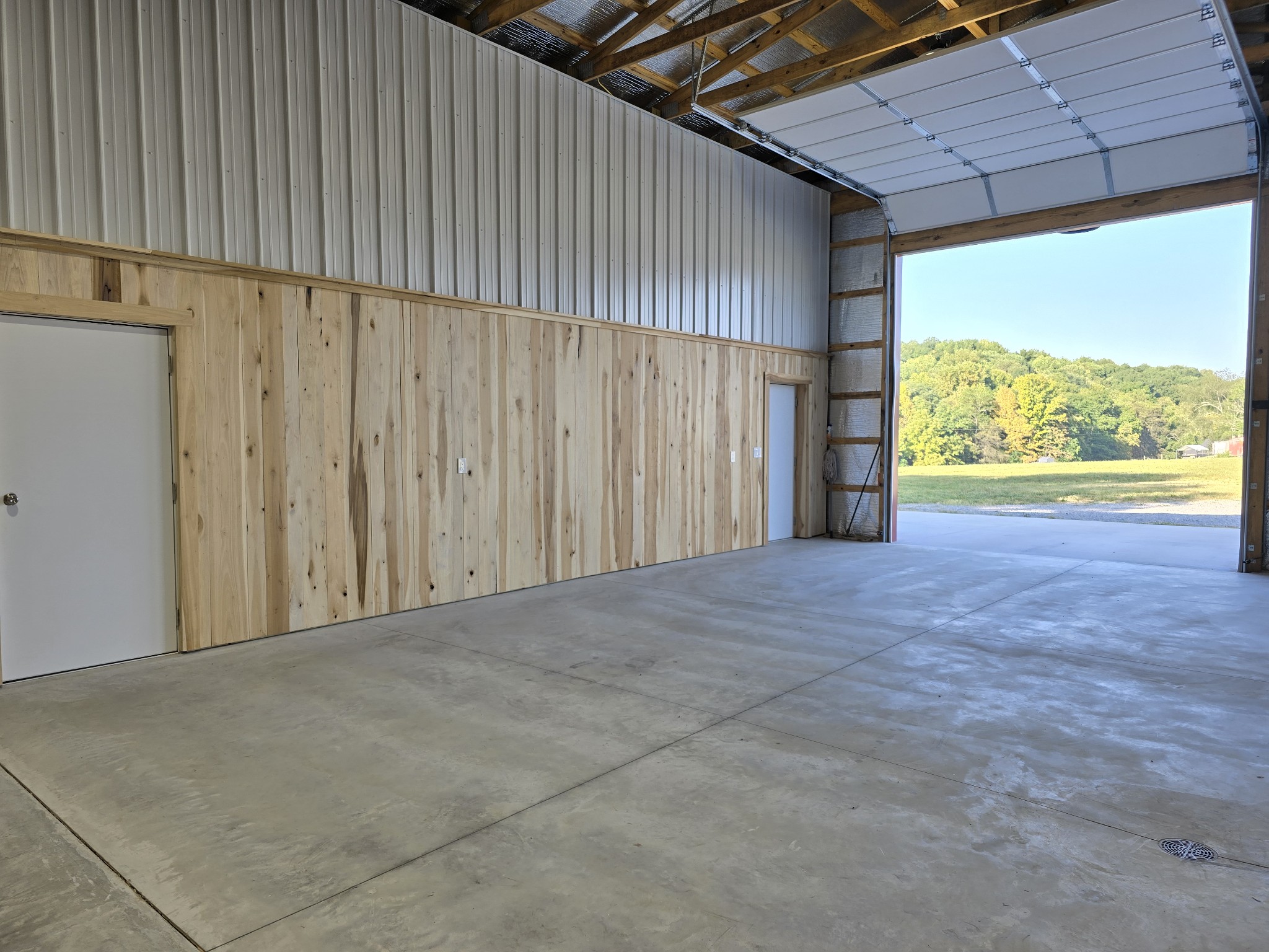 1116 Maxwell Branch Road Cottontown, TN 37048 - Photo 55 of 57 a view of an empty room with a windows and door