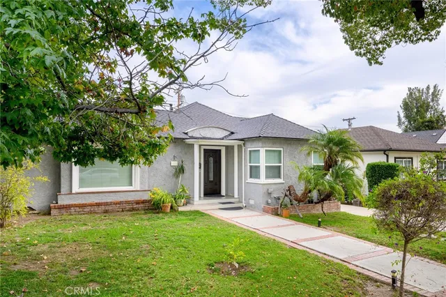 front view of a house with a yard