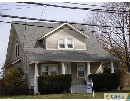 a front view of a house with yard
