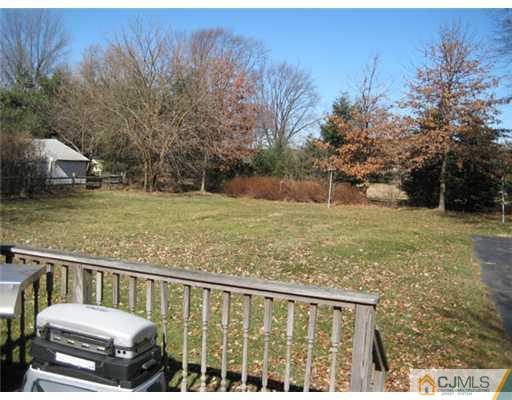 346 Ridge Road Dayton, NJ 08810 - Photo 11 of 12 a view of a deck with a yard