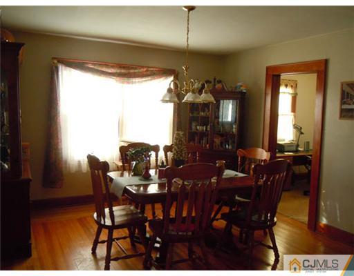 346 Ridge Road Dayton, NJ 08810 - Photo 3 of 12 a view of a dining room with furniture window and wooden floor