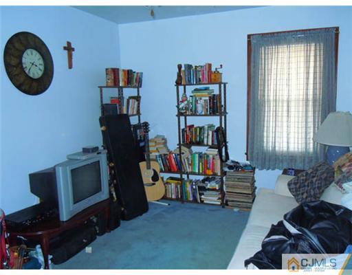 346 Ridge Road Dayton, NJ 08810 - Photo 5 of 12 a living room with furniture a rug and a window