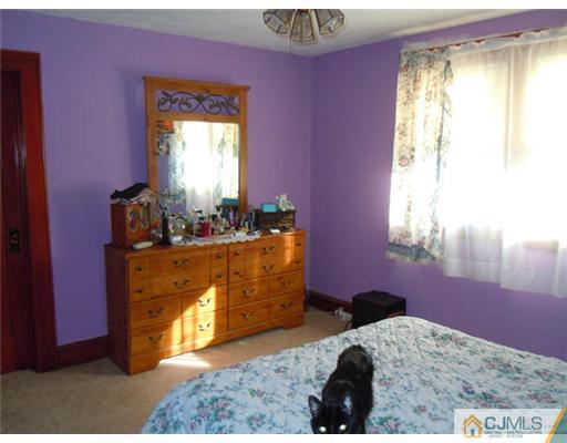 346 Ridge Road Dayton, NJ 08810 - Photo 8 of 12 a bed room with a bed and a window