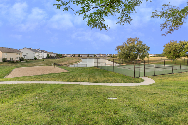 4401 Cummins Street Plano, IL 60545 - Photo 22 of 22 a view of a yard with a house