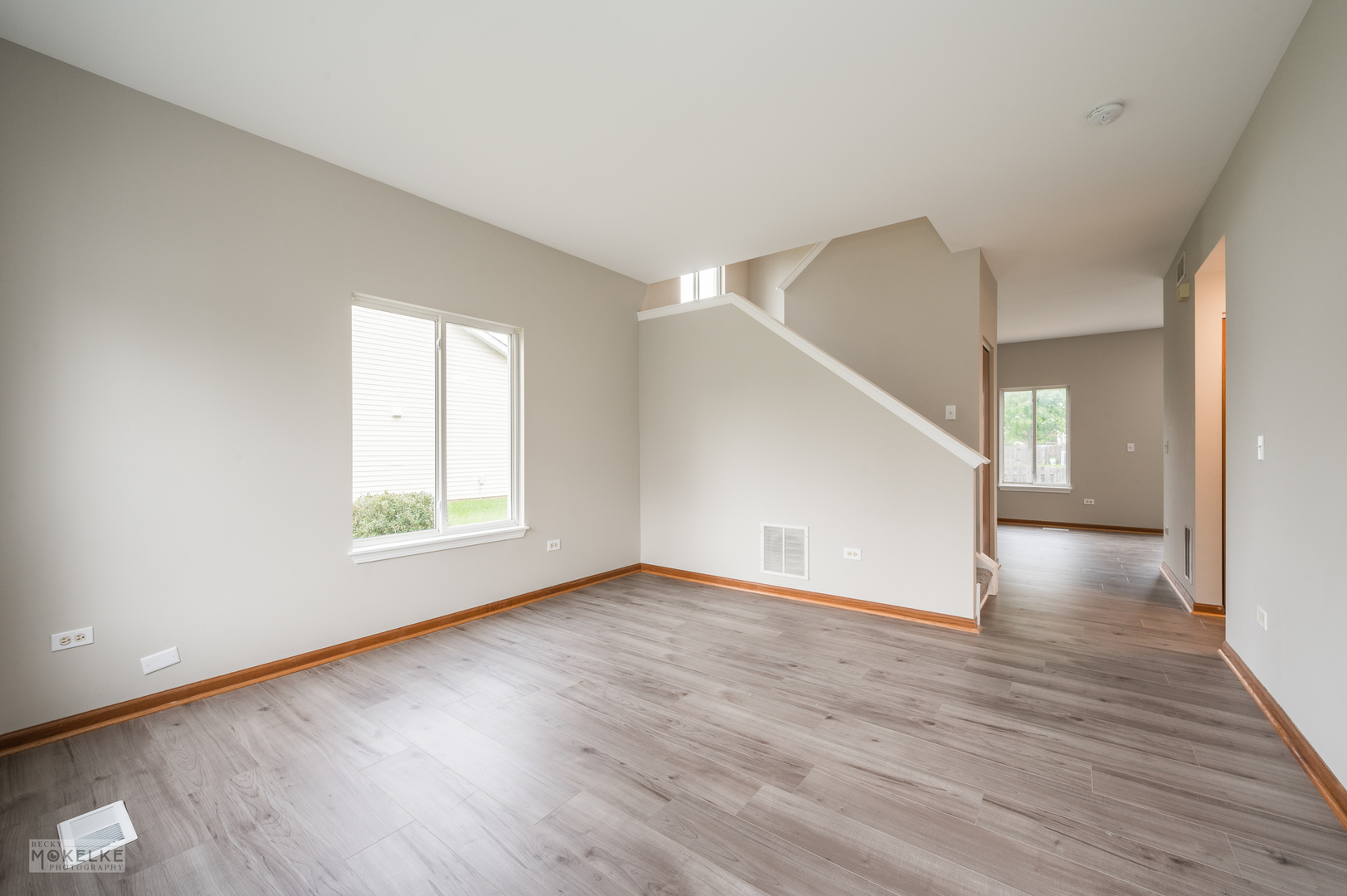 4401 Cummins Street Plano, IL 60545 - Photo 4 of 22 a view of an empty room with wooden floor and a window