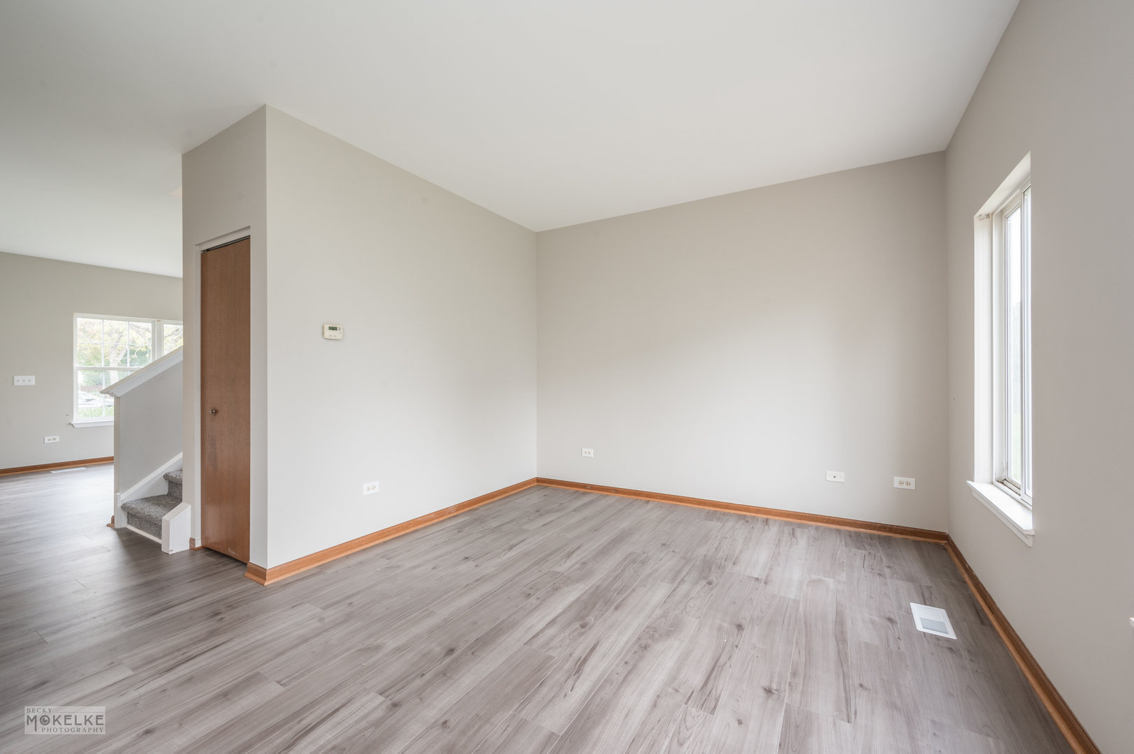 4401 Cummins Street Plano, IL 60545 - Photo 6 of 22 a view of an empty room with wooden floor and a window