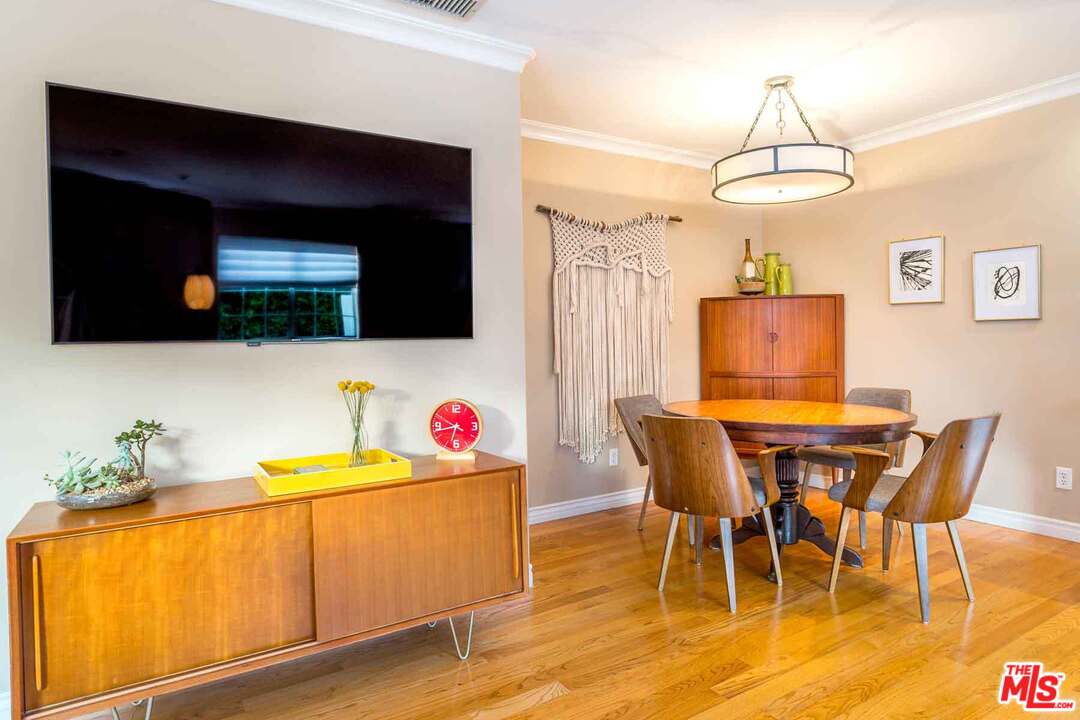 7418 Midfield Avenue Los Angeles, CA 90045 - Photo 11 of 28 a view of a dining room with furniture and wooden floor