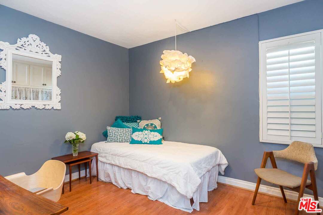 7418 Midfield Avenue Los Angeles, CA 90045 - Photo 17 of 28 a bedroom with a bed table and chair