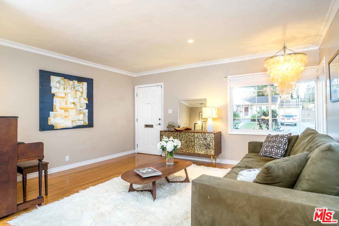 7418 Midfield Avenue Los Angeles, CA 90045 - Photo 3 of 28 a living room with furniture and a large window