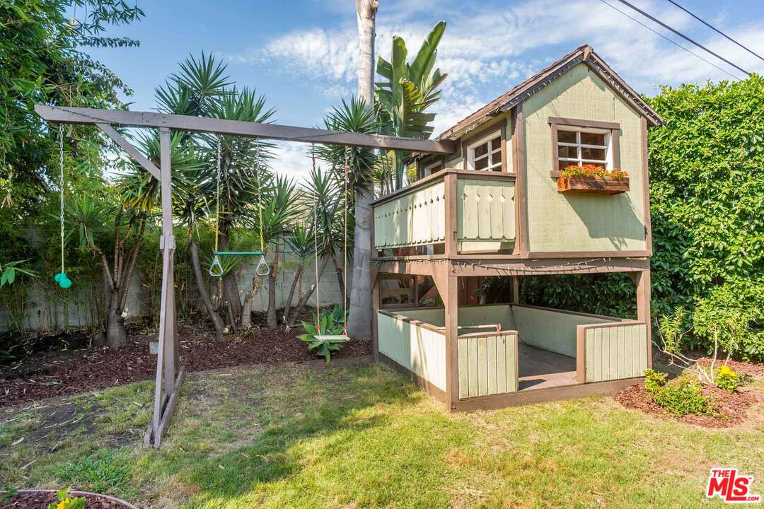 7418 Midfield Avenue Los Angeles, CA 90045 - Photo 25 of 28 a front view of a house with a yard and garage