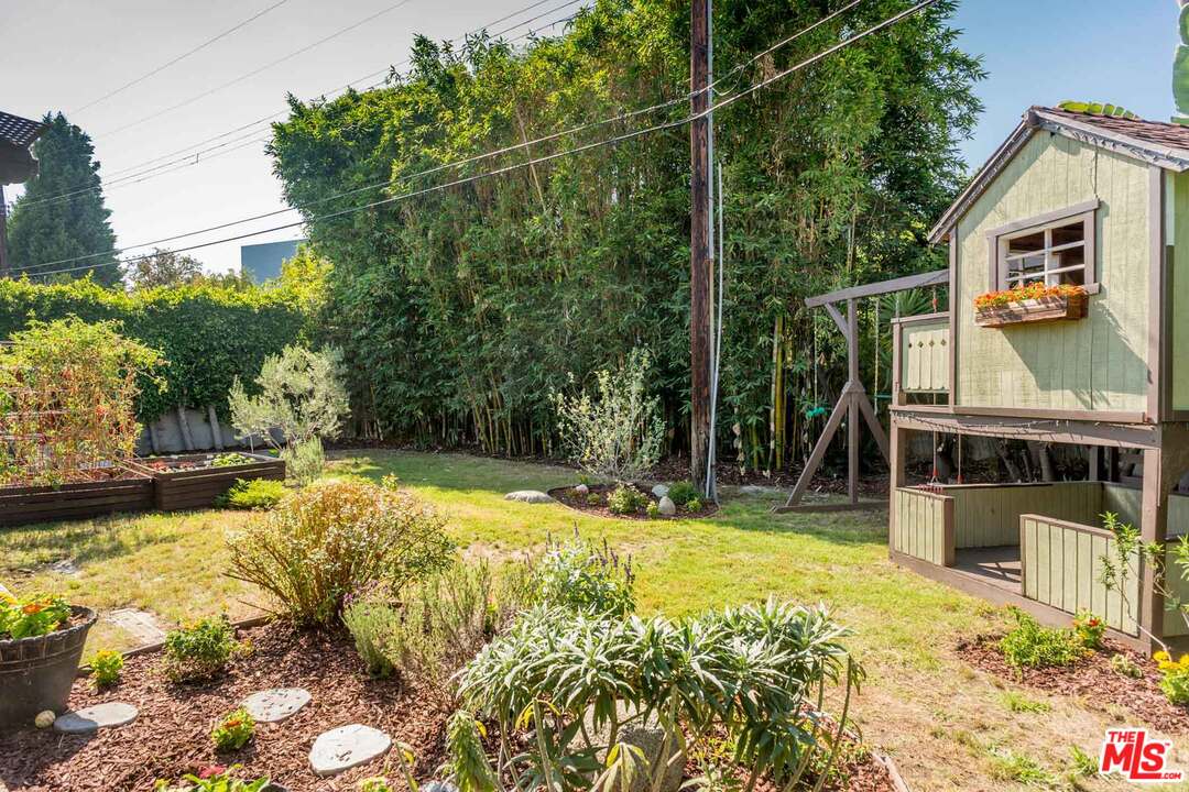 7418 Midfield Avenue Los Angeles, CA 90045 - Photo 28 of 28 a view of swimming pool with lawn chairs and plants