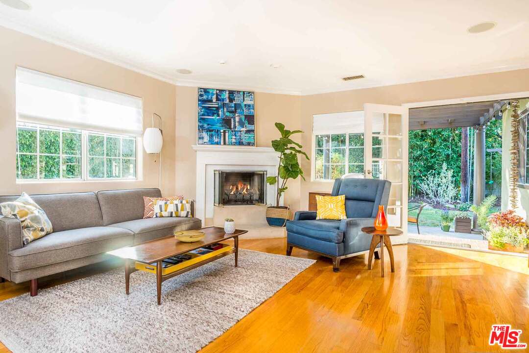 7418 Midfield Avenue Los Angeles, CA 90045 - Photo 5 of 28 a living room with furniture fireplace and a large window