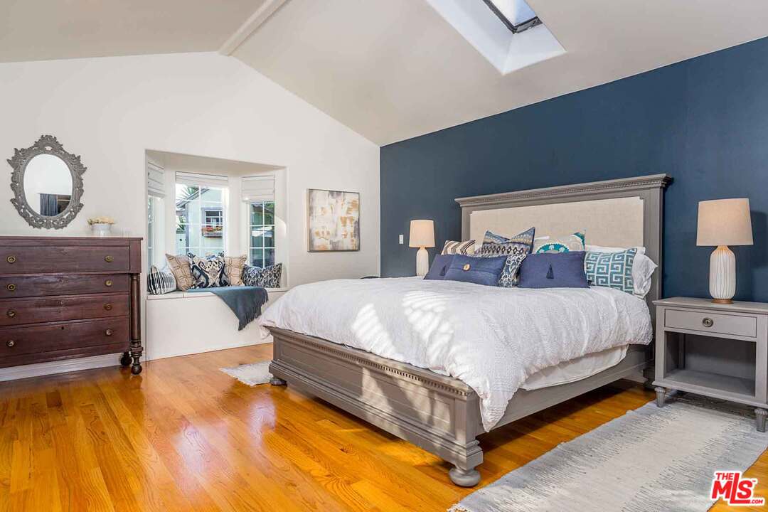 7418 Midfield Avenue Los Angeles, CA 90045 - Photo 7 of 28 a spacious bedroom with a bed and wooden floor