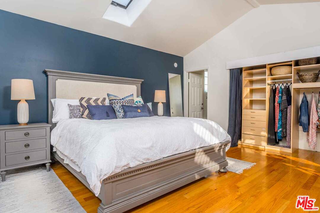 7418 Midfield Avenue Los Angeles, CA 90045 - Photo 8 of 28 a bed sitting in a bedroom next to a window