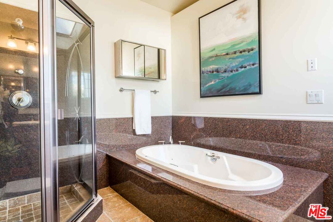 7418 Midfield Avenue Los Angeles, CA 90045 - Photo 10 of 28 a bathroom with a sink and a mirror