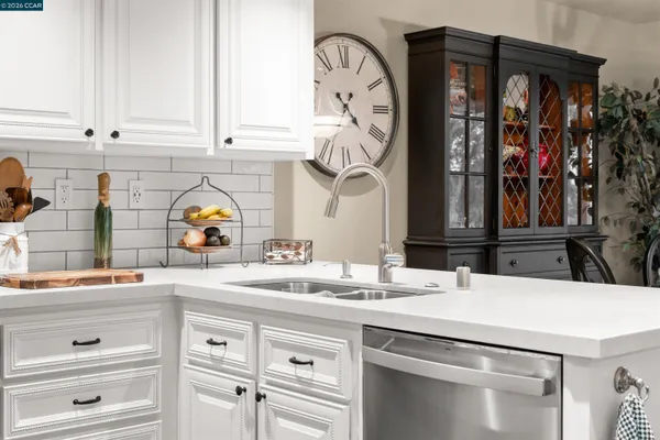 a kitchen with a sink and cabinets