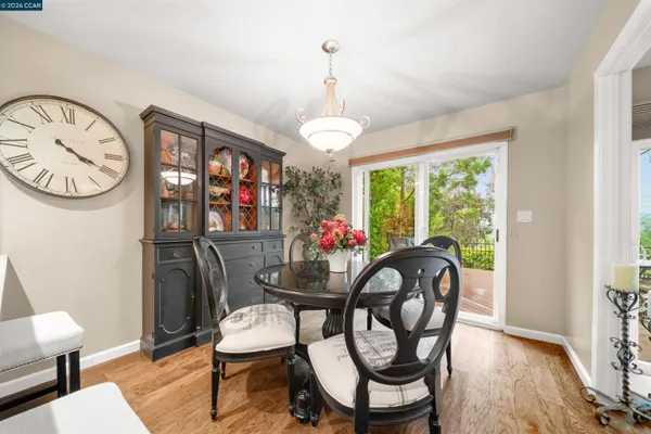 a dining room with furniture and window
