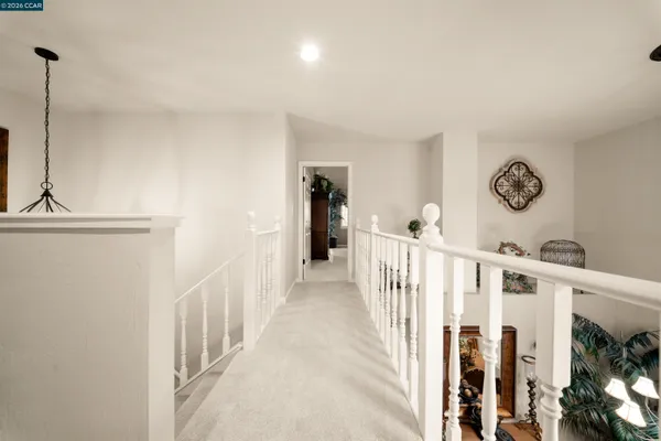 a view of a hallway with windows