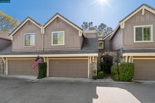 a front view of a house with garage