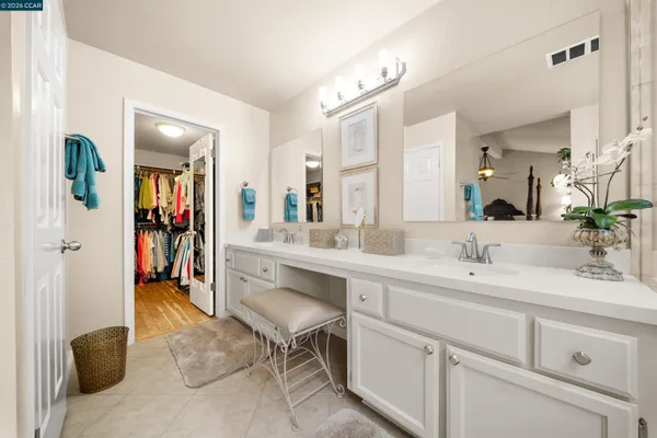 a bathroom with a sink and a large mirror