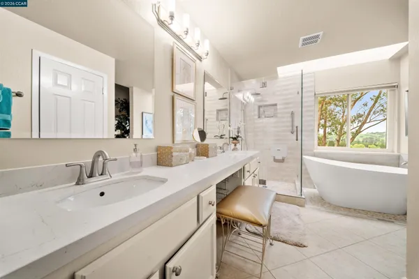 a bathroom with a bathtub and shower