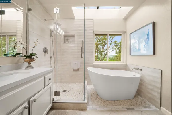 a bathroom with a bathtub and shower
