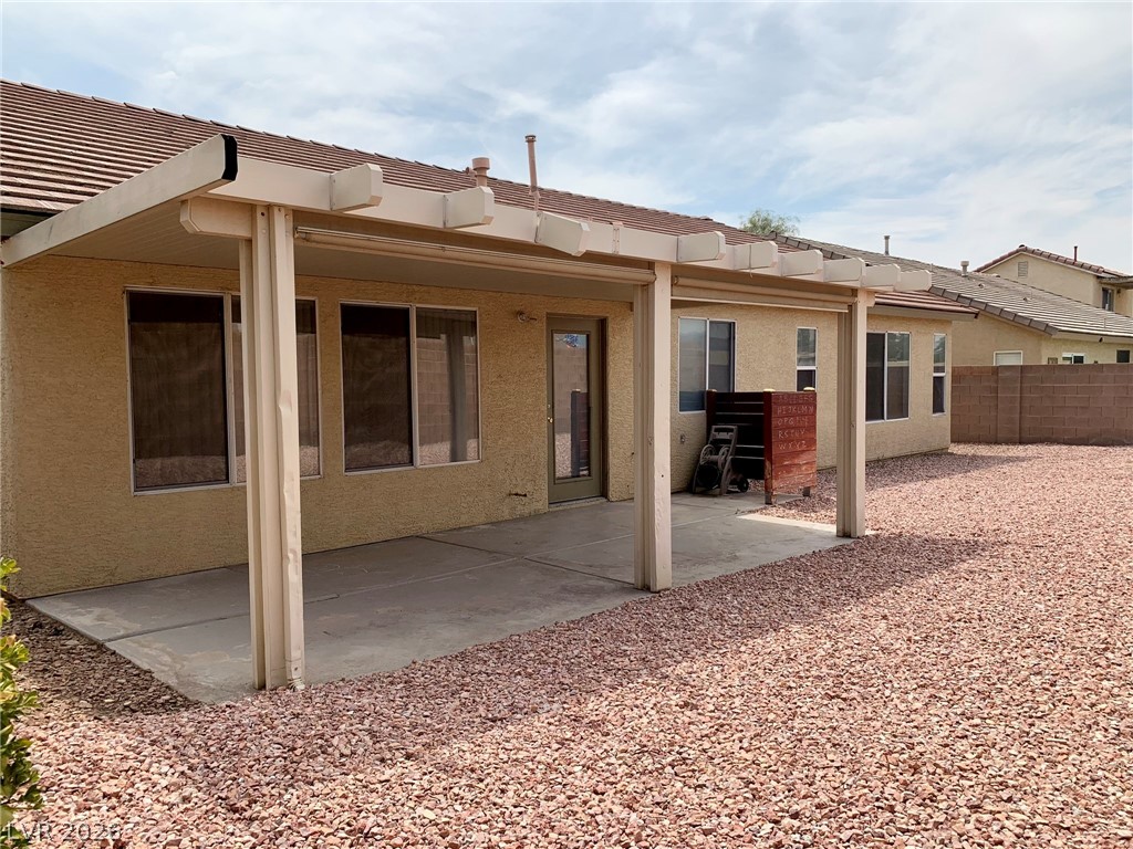 3821 Bombastic Court Las Vegas, NV 89147 - Photo 31 of 36 This spacious private yard features a patio with an inviting covered awning.