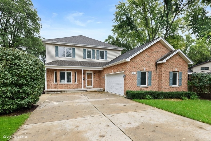 411 South Wilke Road Arlington Heights, IL 60005 - Photo 1 of 29 a front view of house with yard and green space