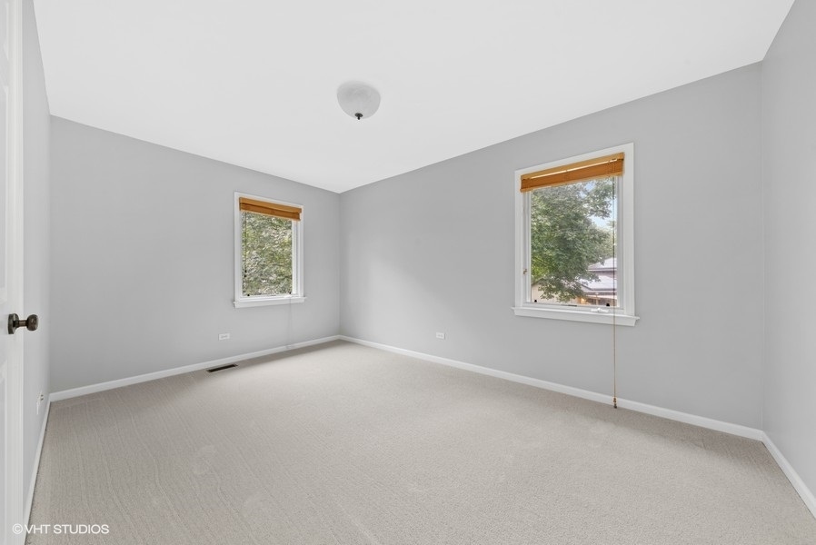 411 South Wilke Road Arlington Heights, IL 60005 - Photo 15 of 29 an empty room with windows