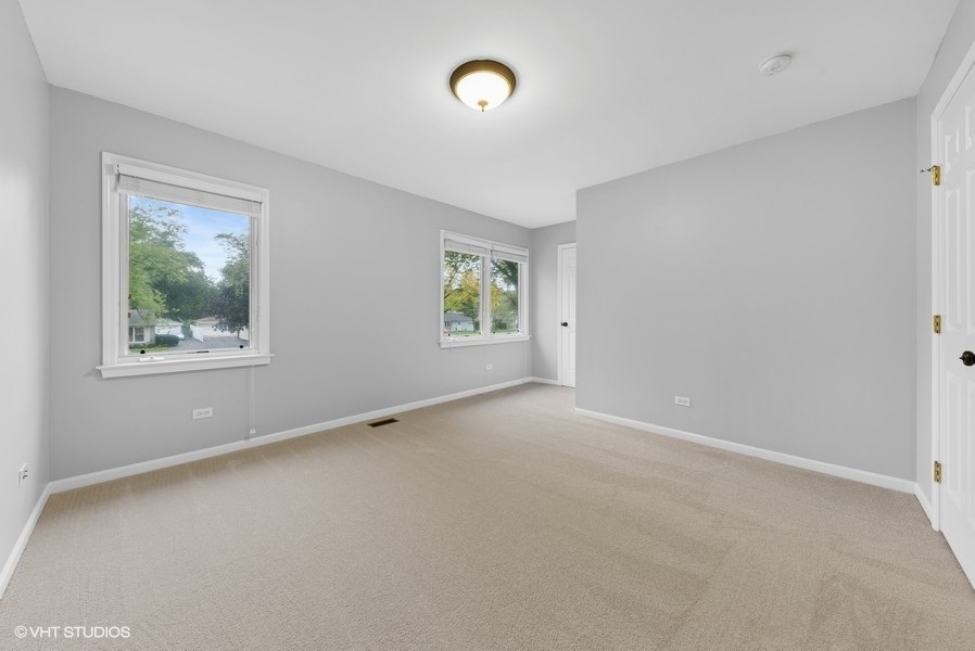 411 South Wilke Road Arlington Heights, IL 60005 - Photo 16 of 29 a view of an empty room with a window